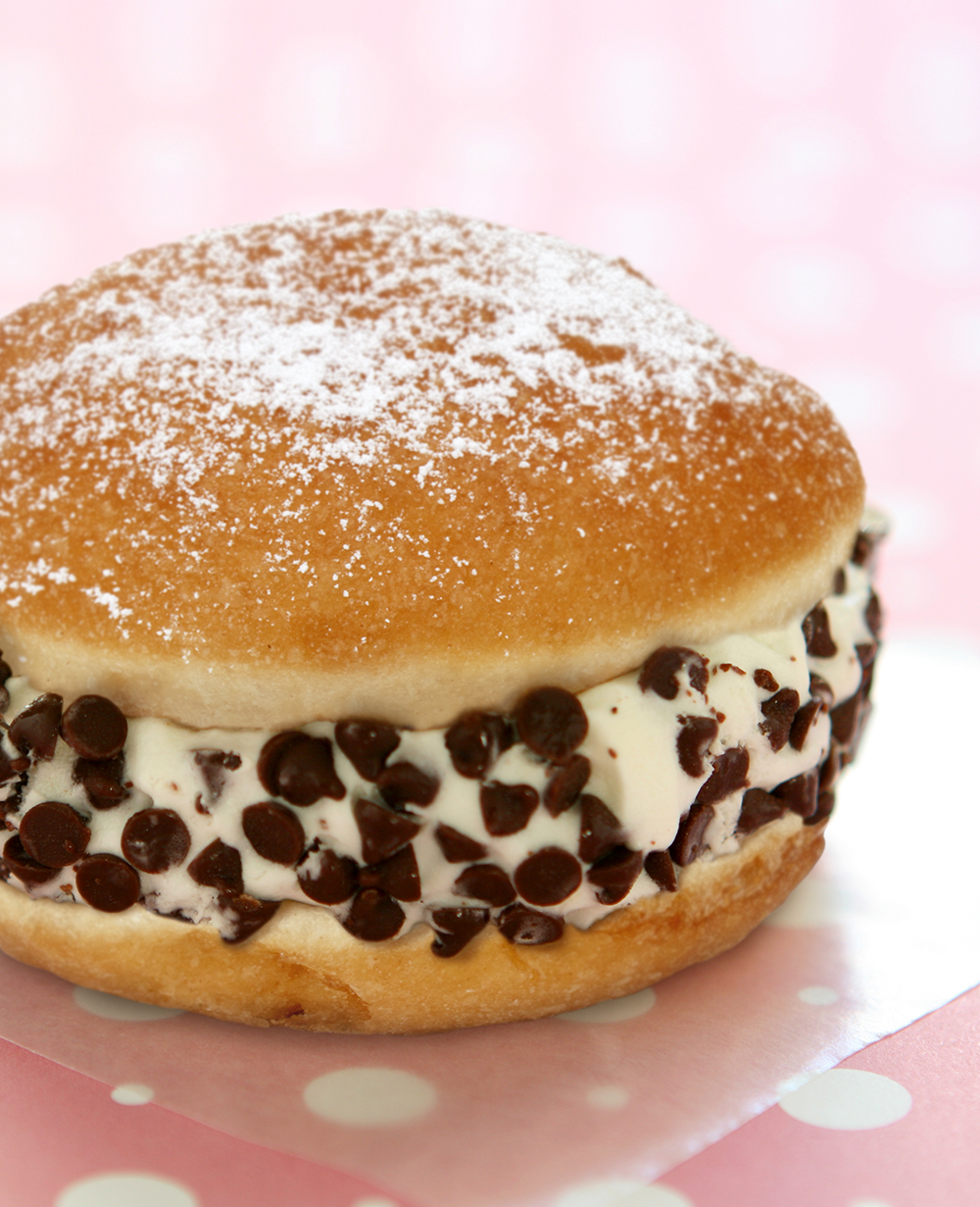 Donut with ice cream and chocolate chips in the middle.